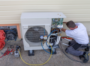 Service worker installing a heat pump unit in Philadelphia, PA