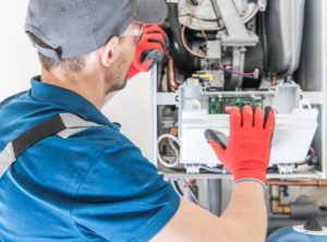 A professional replacing an electric furnace in a home in Philadelphia, PA