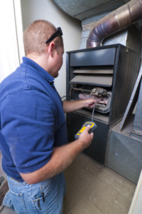 Furnace repair being performed in a home in Philadelphia, PA