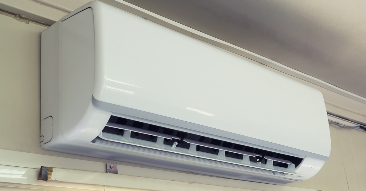 Wall-mounted mini-split indoor AC unit (evaporator) installed on a room wall for cooling and humidity control.