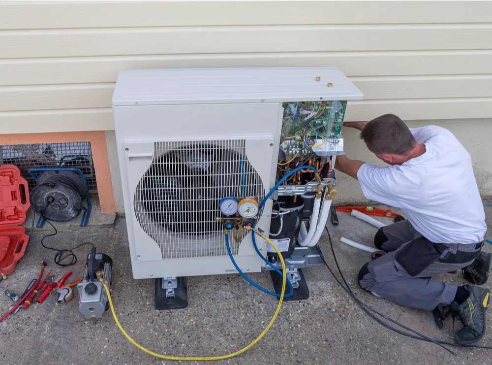 HVAC technician installing a matched split-system furnace and air conditioner